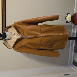 Fashionable  MK faux  sheepskin coat.